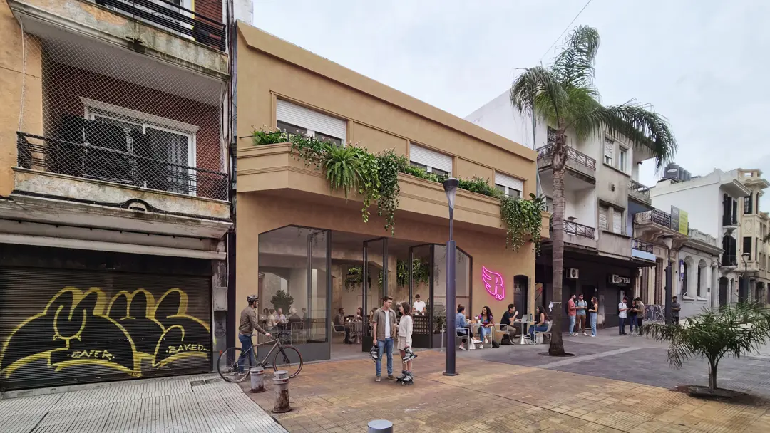 Project render: Rodala's frontage on the Sarandí pedestrian street, with a glass front, a neon sign and tables on the paving.